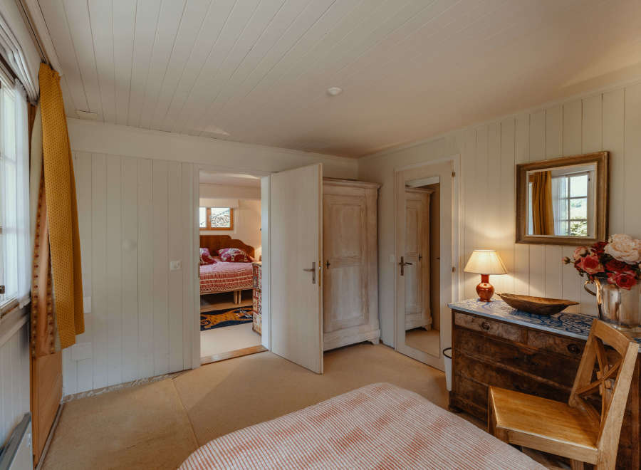 Step into a charming bedroom with a cozy ambiance.