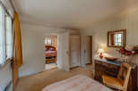 Step into a charming bedroom with a cozy ambiance.