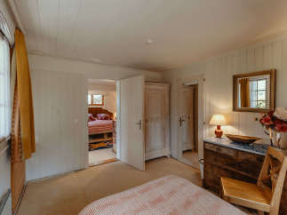 Step into a charming bedroom with a cozy ambiance.
