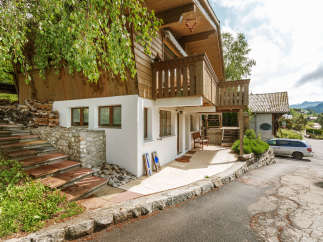 Charming wooden chalet nestled in a picturesque setting.