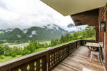 Enjoy breathtaking mountain views from this charming balcony.