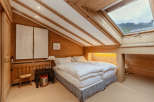 This cozy bedroom features a unique wooden design, creating a warm and inviting atmosphere.