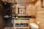 This stunning bathroom features a luxurious shower with a rainfall showerhead, perfect for a relaxing experience.
