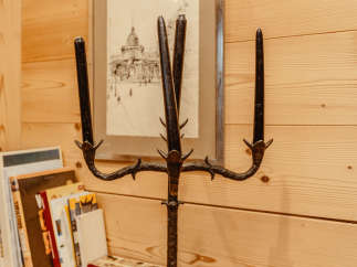 A unique, wrought-iron candelabra stands as a striking decorative element.