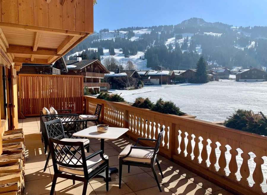 Enjoy breathtaking mountain views from this charming balcony.