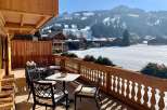 Enjoy breathtaking mountain views from this charming balcony.