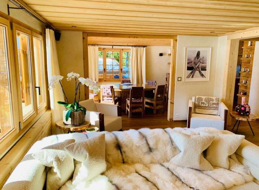 Experience luxury living in this stunning property, featuring a cozy living room with a plush sofa and elegant decor.