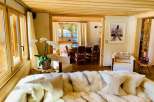 Experience luxury living in this stunning property, featuring a cozy living room with a plush sofa and elegant decor.