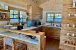 This stunning kitchen boasts a rustic yet modern design, perfect for a cozy and inviting atmosphere.