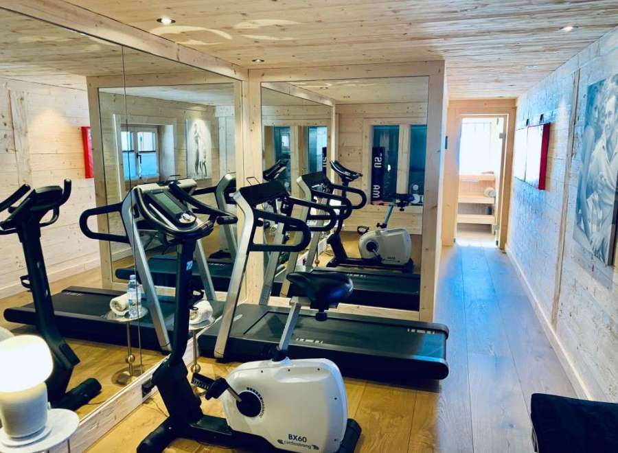 This luxurious gym boasts a modern design with state-of-the-art equipment, perfect for a comprehensive workout.