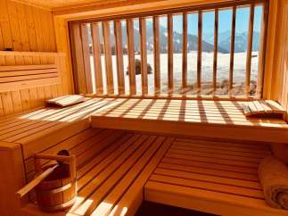 Relax and rejuvenate in this stunning sauna with breathtaking mountain views.