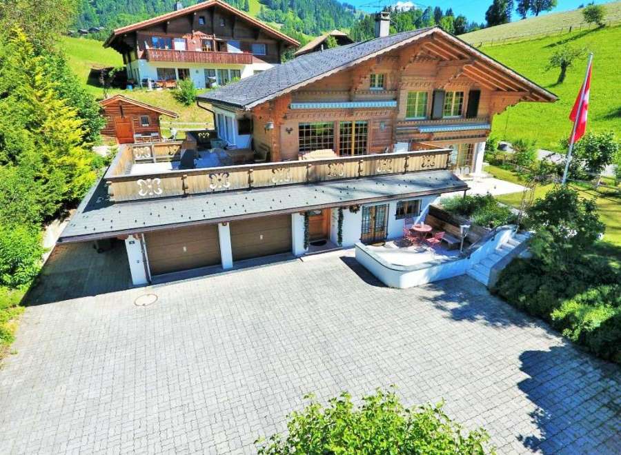Discover your dream home in the heart of the Swiss Alps! This stunning property boasts a charming wooden exterior, offering a warm and inviting atmosphere.