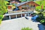 Discover your dream home in the heart of the Swiss Alps! This stunning property boasts a charming wooden exterior, offering a warm and inviting atmosphere.