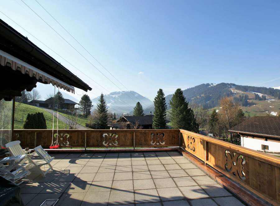 Enjoy breathtaking mountain views from this charming balcony.