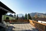 Enjoy breathtaking mountain views from this charming balcony.