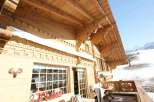 Experience the charm of this stunning wooden chalet, showcasing intricate architectural details.