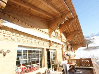 Experience the charm of this stunning wooden chalet, showcasing intricate architectural details.