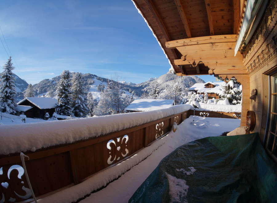 Experience the charm of a winter wonderland from this cozy balcony.