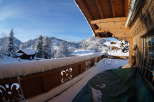 Experience the charm of a winter wonderland from this cozy balcony.