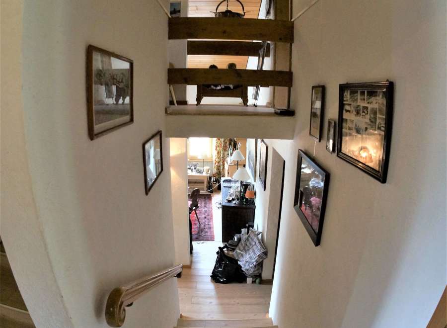 This stunning property features a unique staircase design, showcasing a blend of modern and classic elements.