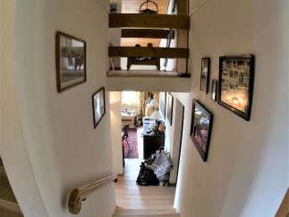 This stunning property features a unique staircase design, showcasing a blend of modern and classic elements.