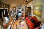 Step into a charming, rustic interior with exposed wooden beams and a cozy atmosphere.