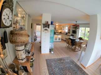 Step into a charming home with a warm and inviting atmosphere.
