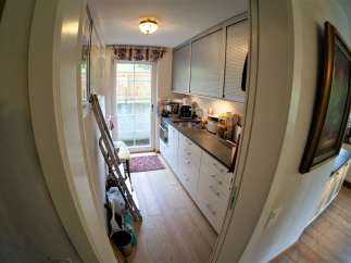 This charming kitchen features a bright and airy design with ample natural light.