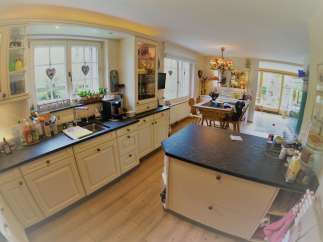 This charming kitchen boasts a bright and airy atmosphere, perfect for culinary adventures.