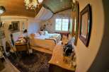 Step into a bedroom that exudes elegance and charm.