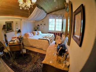 Step into a bedroom that exudes elegance and charm.