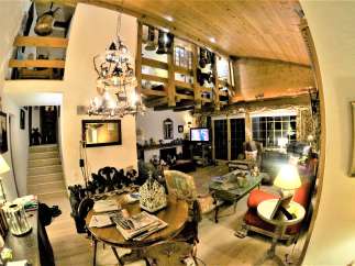 Step into a cozy chalet-style living room, perfect for relaxation.