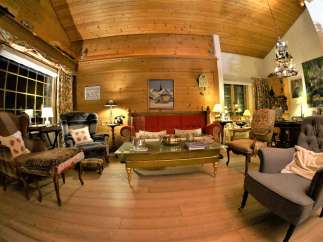 Step into a cozy and inviting living space with a warm, wooden interior.