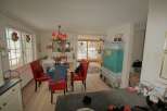 This charming property boasts a cozy dining area, perfect for gatherings.