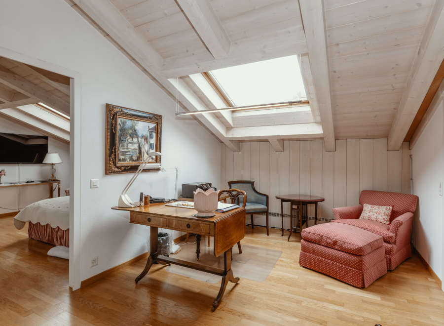 Discover a charming attic space with a unique design.
