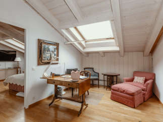 Discover a charming attic space with a unique design.