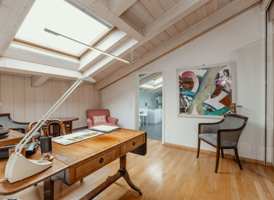 Discover a bright and airy home office with a unique architectural design.