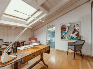 Discover a bright and airy home office with a unique architectural design.