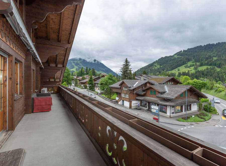 Enjoy breathtaking mountain views from this charming balcony.