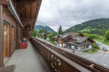 Enjoy breathtaking mountain views from this charming balcony.