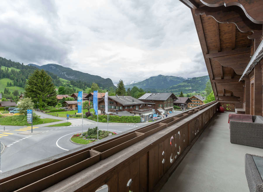 Enjoy breathtaking mountain views from this charming balcony.