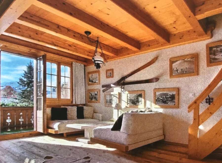 Experience the charm of this cozy chalet, featuring a warm wooden interior and stunning mountain views.