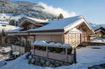 This stunning chalet boasts a picturesque winter landscape, perfect for a cozy getaway.