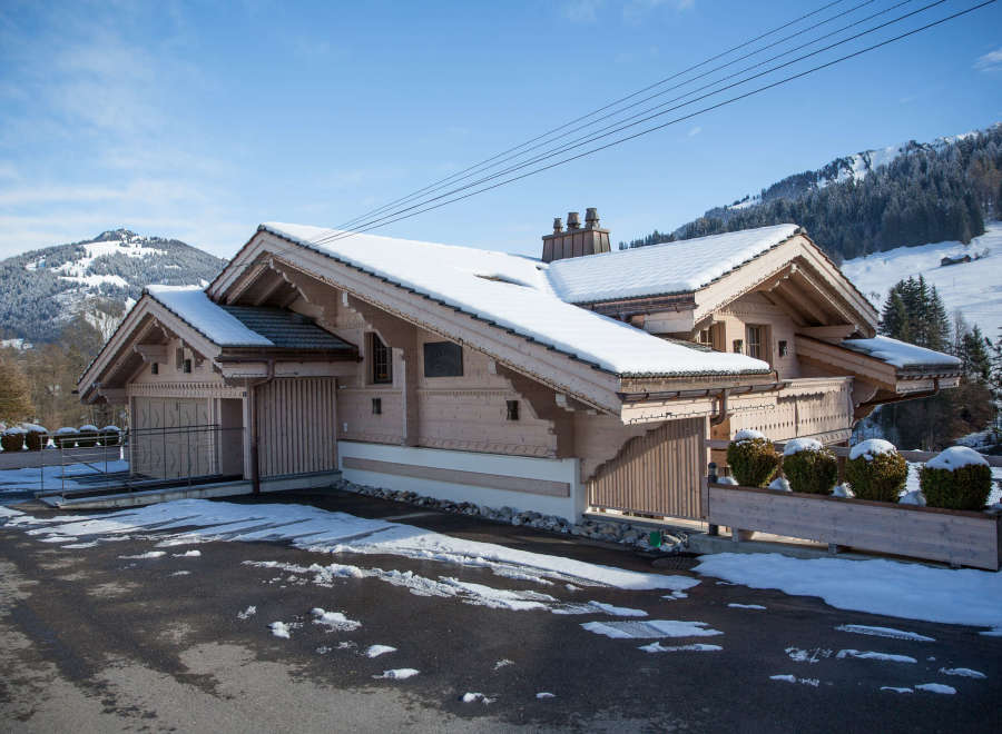 This stunning property showcases a beautiful chalet-style design, perfect for a winter getaway.