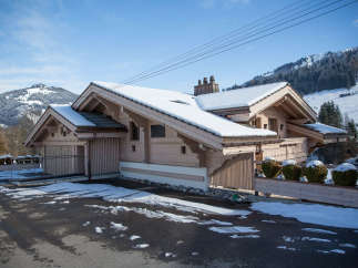 This stunning property showcases a beautiful chalet-style design, perfect for a winter getaway.