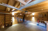 This charming wooden garage offers a warm and inviting space.