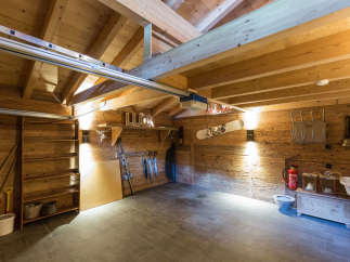 This charming wooden garage offers a warm and inviting space.