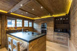 Experience rustic elegance in this stunning kitchen, featuring warm wooden accents and a sleek, modern design.