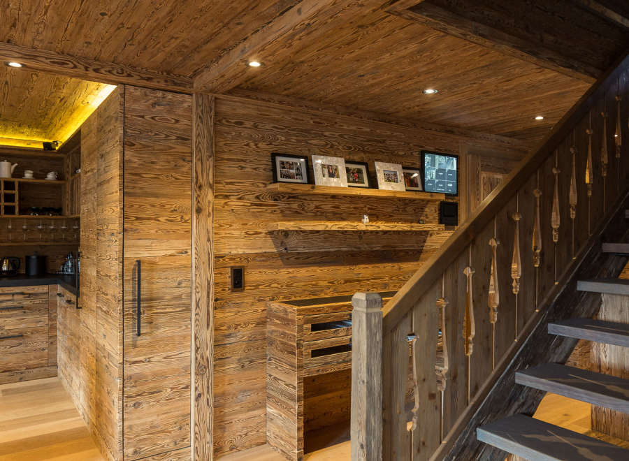 Experience rustic elegance in this stunning home, featuring exquisite wood paneling and flooring throughout.