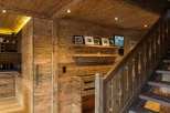 Experience rustic elegance in this stunning home, featuring exquisite wood paneling and flooring throughout.